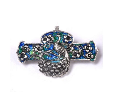 William Hair Haseler Enamel panel brooch depciting a peacock amongst flowerheads and foliage signed 'WHH' and stamped 'Silver