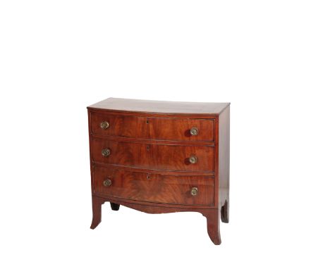 A REGENCY MAHOGANY BOW FRONTED CHEST OF DRAWERS, circa 1815, the crossbanded top with moulded front and side edges, the three