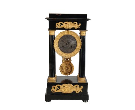 A RESTAURATION EBONIZED PORTICO CLOCK, with gilt metal mounts and a conforming pendulum cast with shells surrounding a centra