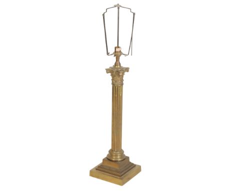 A VICTORIAN BRASS COLUMNAR TABLE LAMP, late 19th century and later adapted, with Composite capital reeded shaft, waisted socl