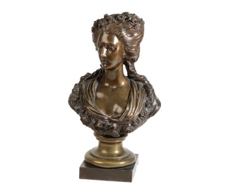 A FRENCH PATINATED BRONZE BUST OF A MAIDEN, IN 18TH CENTURY STYLE, last quarter 19th century, her hair worn up and adorned wi