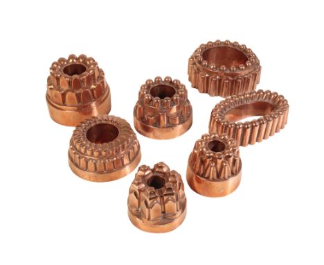 SEVEN VICTORIAN COPPER 'JELLY' MOULDS, last quarter 19th century, all of hollow ring form, (one of oval section), of varying 