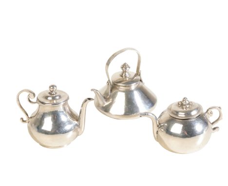 A DUTCH SILVER MINIATURE TEA POT the teapot possibly Fredrick Van Strant, 17th/18th century, with hinged shaped handle and tw