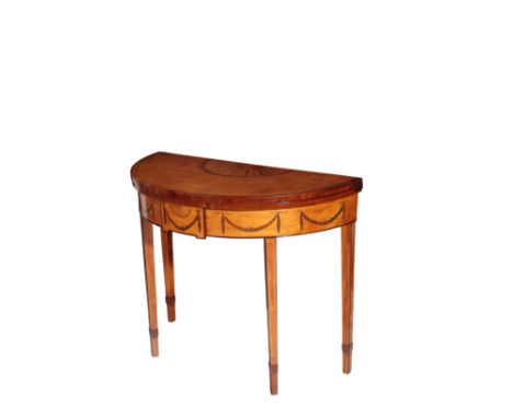 A SATINWOOD AND MARQUETRY DEMI-LUNE FOLDING CARD TABLE IN SHERATON TASTE, late 19th century, the hinged top with half fan pat