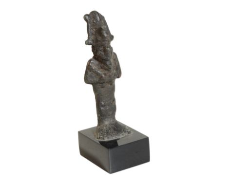 AN EGYPTIAN BRONZE MODEL OF OSIRIS, probably Late Period, 712 - 323 B.C., cast standing and traditionally portrayed wearing t