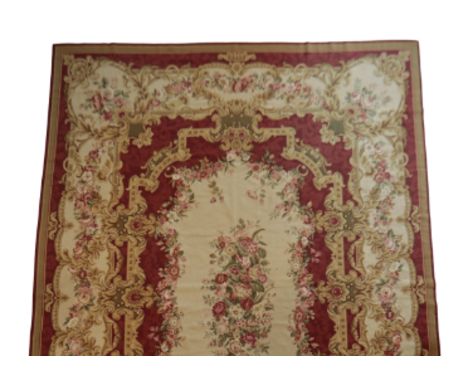 AUBUSSON STYLE CARPET, 20th century, the central floral spray on cream ground, within gold and red borders and guards populat