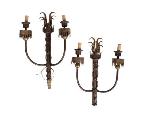 A PAIR OF WROUGHT IRON TWIN LIGHT WALL APPLIQUES, IN GOTHIC REVIVAL TASTE, each with electrical fitments in urn sockets, the 