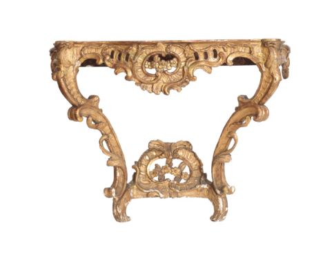 A LOUIS XV CARVED AND GILTWOOD AND MARBLE MOUNTED CONSOLE TABLE, third quarter 18th century, the brick red, grey and striated