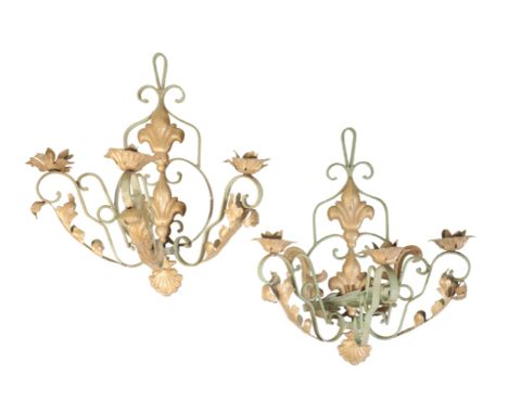 A PAIR OF CONTINENTAL PAINTED WROUGHT IRON THREE LIGHT WALL APPLIQUES, 20th century, the pressed metal floral drip pans on op