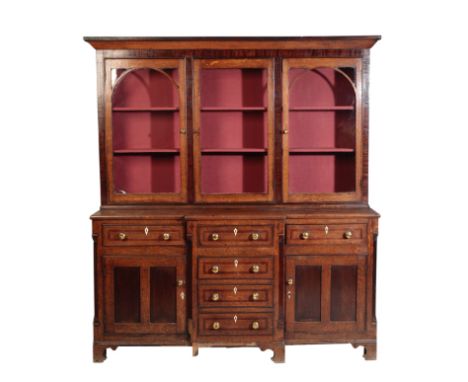 A GEORGE III OAK AND WALNUT BANDED DRESSER, circa 1800 and later, the associated upper section with cornice above three glaze