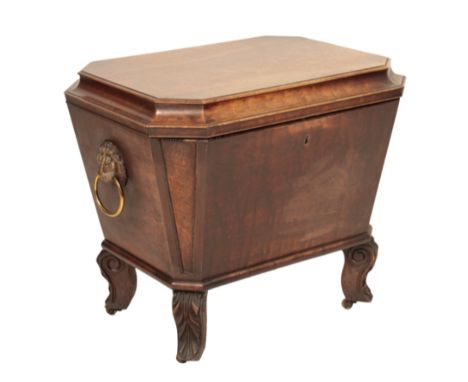 A REGENCY MAHOGANY CELLARET, circa 1815, of sarcophagus form and octagonal section, the hinged cover with cavetto moulded sid