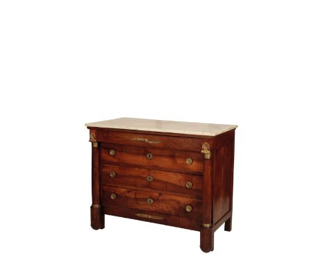 AN EMPIRE CHERRY WOOD, GILT BRONZE MOUNTED AND MARBLE TOPPED COMMODE, early 19th century, the rectangular top above a project