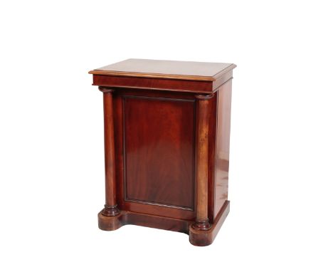 A VICTORIAN MAHOGANY PEDESTAL CABNET, mid 19th century, the rectangular top with moulded front and side edges, the panel door