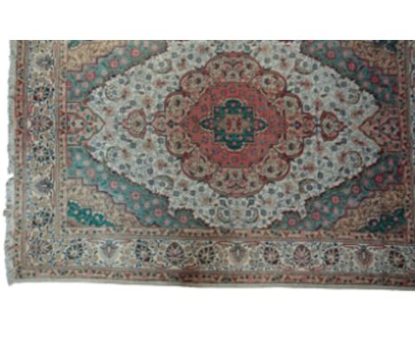 SARUK STYLE RUG North West Persian, the small central medallion within graduating rings of colour and floral patternation, an