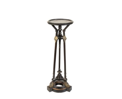 AN AESTHETIC MOVEMENT EBONISED WOOD AND GILT METAL MOUNTED TORCHERE OR VASE STAND, circa 1870, the circular top with a knoppe