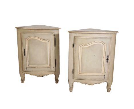 A PAIR OF LOUIS XV PROVINCIAL PAINTED WOOD ENCOIGNURES, third quarter 18th century, bow fronted, the tops each with ovolo mou