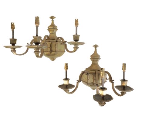 A PAIR OF BRASS TWIN LIGHT WALL APPLIQUES IN REGENCE STYLE, 20th century, the electrical fitments in hexagonal section urn so