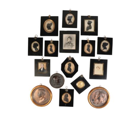 A SMALL COLLECTION OF MINIATURES, 19th century, all in ebonised frames; a bois durci portrait relief roundel of Pope Pius IX,