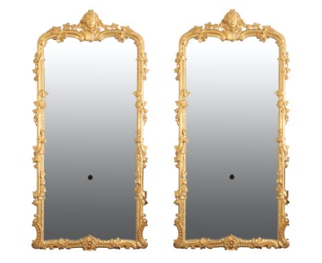 A PAIR OF SUBSTANTIAL GILTWOOD FRAMED GIRANDOLES, IN ROCOCO TASTE, of recent manufacture, of loosely rectangular form, each w