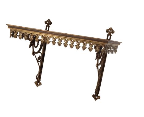 A VICTORIAN GILT METAL AND OAK WALL BRACKET, in the manner of A.W.N. Pugin, the rectangular top with moulded front and sides,