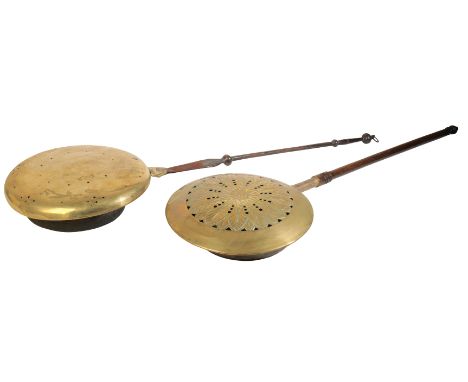 A GEORGE II BRASS AND WROUGHT IRON MOUNTED BED WARMING PAN, circa 1730, the hinged and domed cover with incised and pierced d