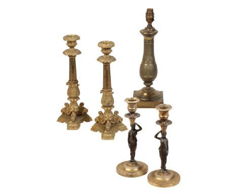 A PAIR OF LOUIS PHILIPPE GILT BRONZE CANDLESTICKS, circa 1840, with foliate cast urn sockets, tapered shafts, scrolled feet a