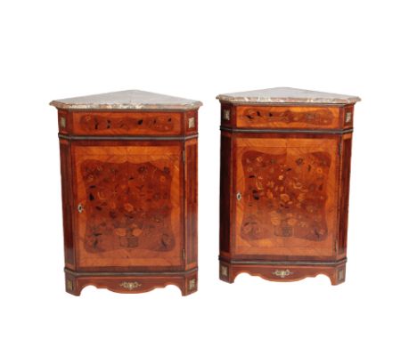 A PAIR OF LOUIS XVI STYLE WALNUT AND MARQUETRY ENCOIGNURES, the mottled brown and white marble tops with moulded edges, above