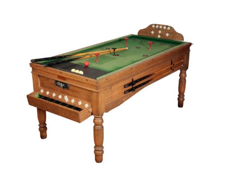 AN OAK AND BEECH BAR BILLIARDS TABLE, early 20th century, fully reconditioned by Bar Billiards Ltd of Ascot, the cushion side