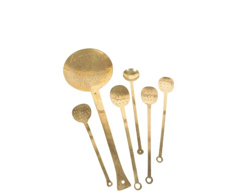 FIVE BRASS STOCK SKIMMERS, probably late 17th /early 18th century, including a rare example of substantial proportions, with 