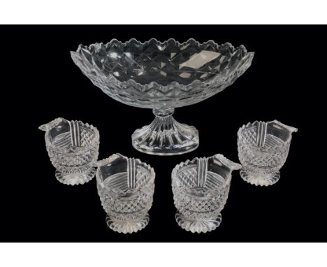 A LATE GEORGE III IRISH GLASS FRUIT BOWL with an oval boat-shaped body with bowl hob-cut decoration and an undulating rim, on