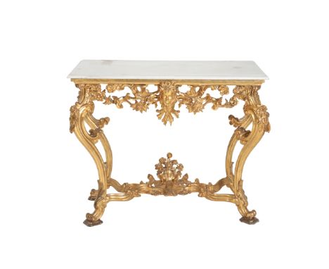 A CARVED AND GILTWOOD AND WHITE MARBLE MOUNTED CONSOLE TABLE, IN LOUIS XV STYLE, the rectangular top with moulded front and s