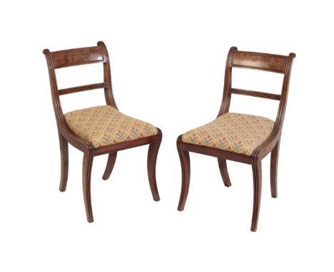 A SET OF FOUR REGENCY MAHOGANY DINING CHAIRS, circa 1815, each with panel backrest above a horizontal reeded splat, with reed