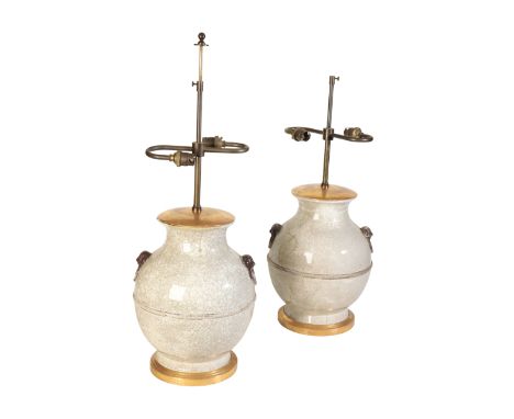 A PAIR OF CHINESE CRACKLEWARE" VASES CONVERTED TO TABLE LAMPS" each with a ribbed ovoid body with bronzed mask handles and gi