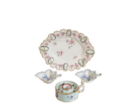 A CHELSEA GOLD ANCHOR" OVAL DISH" enameled in polychrome with a border of roses and circlets of leaves within an undulating b