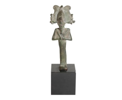 AN EGYPTIAN BRONZE MODEL OF OSIRIS, probably Late Period, 712 - 323 B.C., cast standing and wearing the plumedÂ&nbsp;AtefÂ&nb