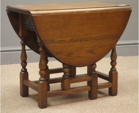 Small oval medium oak drop leaf coffee table with gate action support, W59cm, H48cm, D82cm