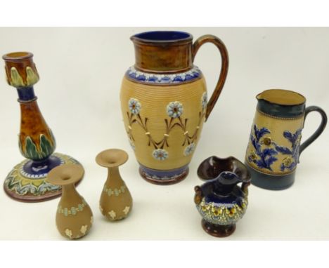 Doulton Lambeth stoneware pottery comprising a pitcher the body having coiled decoration with flower roundels and stylised le