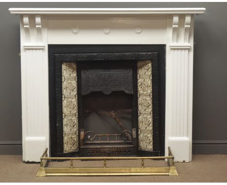 Edwardian cast iron fire inset with tiled sides, white finish surround, projecting cornice, reeded column supports, brass fen