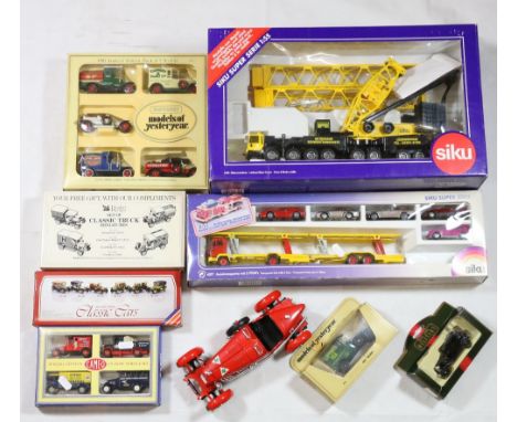 Siku 4310 1:55 scale latticed mast crane and 4017 transporter set with five cars, boxed, etc.   CONDITION REPORT:  Generally 