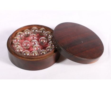 19th century Sikes hydrometer floats for proving spirits numbered 18 to 36, in cylindrical mahogany box.