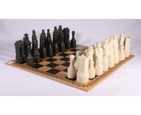 BENEAGLES The Thistle and the Rose chess set, the sixteen large pieces being miniature decanters containing Beneagles Scotch 