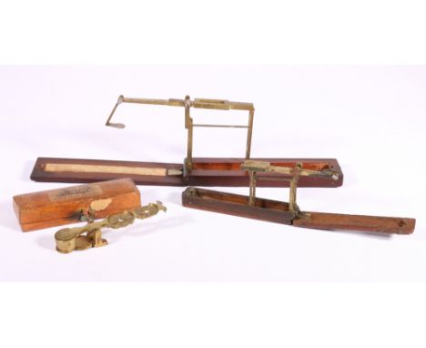 A Wilkinson of Kirkby mahogany cased guinea scales, another cased set of pocket guinea scales and set of sovereign scales.   