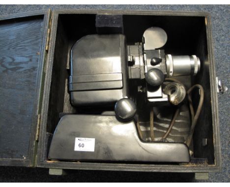 Vintage projector in original wooden box.