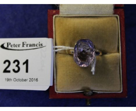 Oval amethyst dress ring on yellow metal shank.  Cased.