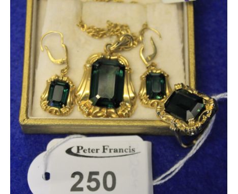 18ct gold set green tourmaline baguette stone four piece jewellery garniture, pendant, ring and pair of earrings.  Boxed. CON