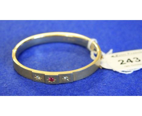 Victorian 9ct gold hinged bangle with ruby and white sapphire stones. CONDITION REPORT: Dented and misshapen in places. No lo