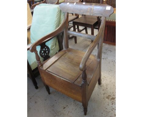 19th Century oak bar back commode armchair.