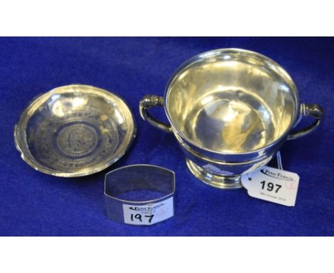 Irish silver two handled presentation trophy cup, Dublin, possibly 1926 (rubbed), an Islamic silver dish and a silver napkin 