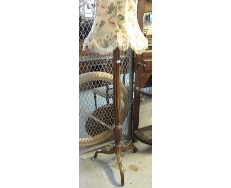 Modern hardwood tripod standard lamp with shade.