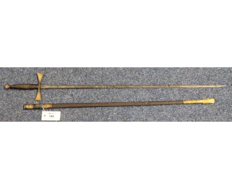 A Masonic sword, the blade etched with foliate designs and Masonic devices, and having brass hilt and brass mounted leather s